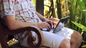 stock-footage-man-fall-asleep-during-working-on-laptop-in-the-garden